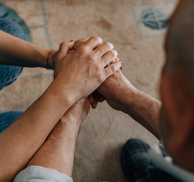 two people holding hands