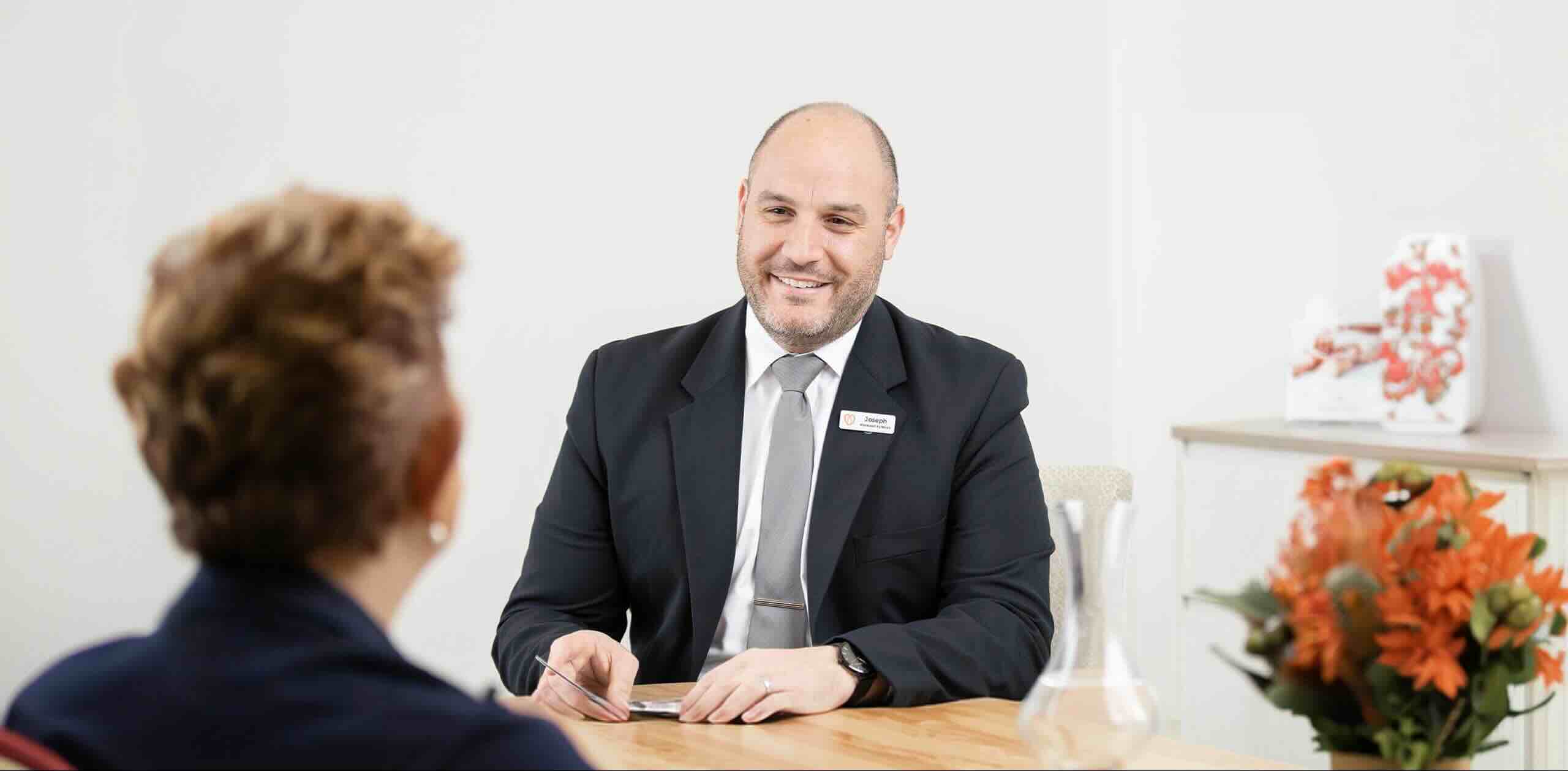 Purslowe & Chipper funeral director with client