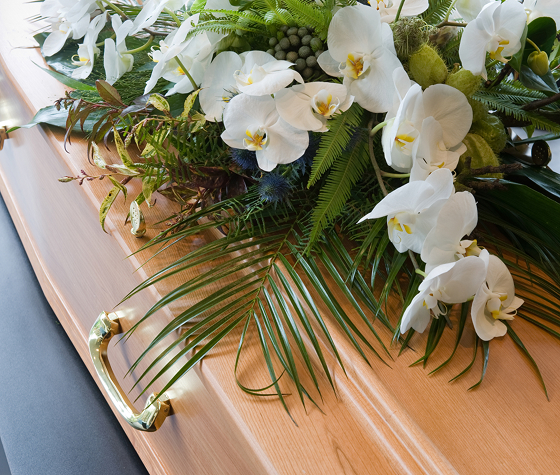 image of coffin with flowers