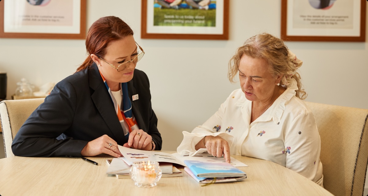 funeral director helping woman