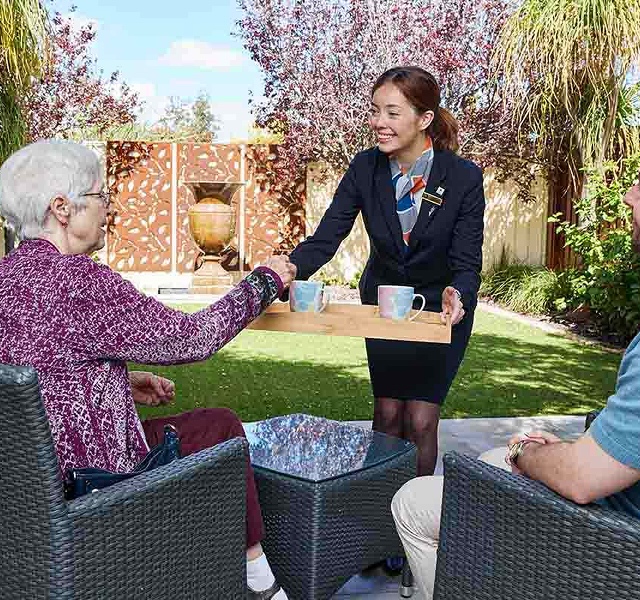 funeral director serving food and drinks
