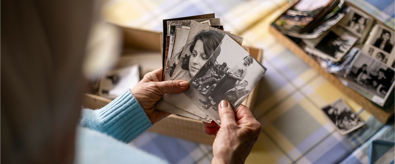 woman looking at old photos