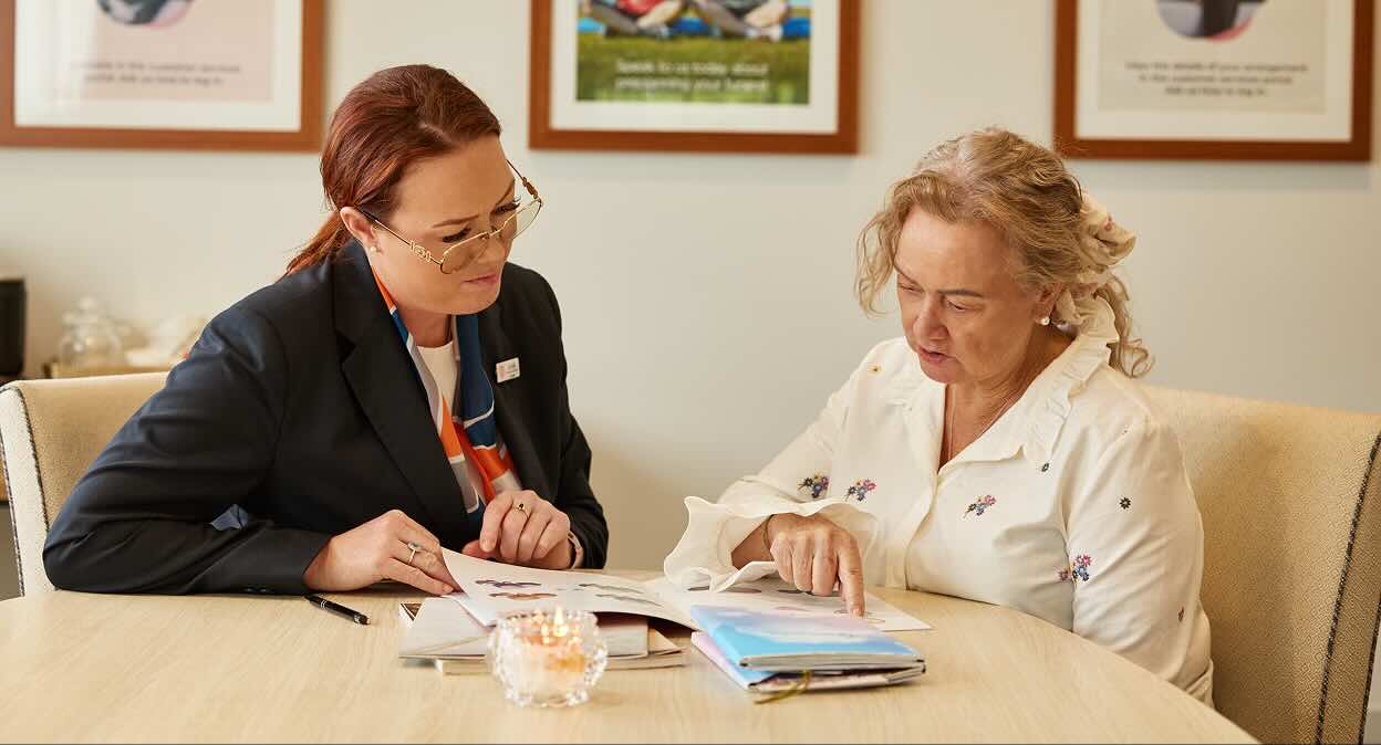 funeral director helping woman plan a funeral